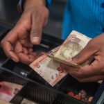 Finance Minister Enoch Godongwana reviewing South Africa's fiscal strategy as debt stabilises and the economy shows signs of recovery.