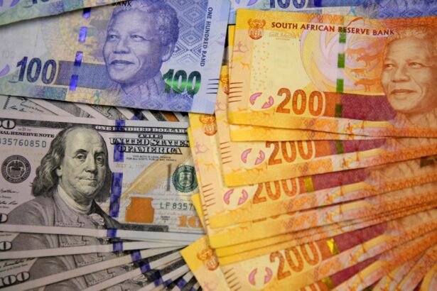 South African rand notes with stock market chart showing currency fluctuation