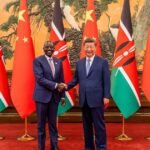 Kenyan President William Ruto and Chinese President Xi Jinping shaking hands with Chinese and Kenyan flags, symbolizing Kenya-China trade agreement and export growth